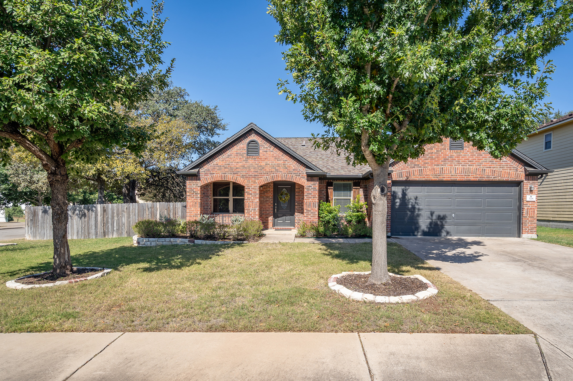 328 Cedar Lake Boulevard Georgetown, TX 78633 - Photo 1 of 34 a front view of a house with garden