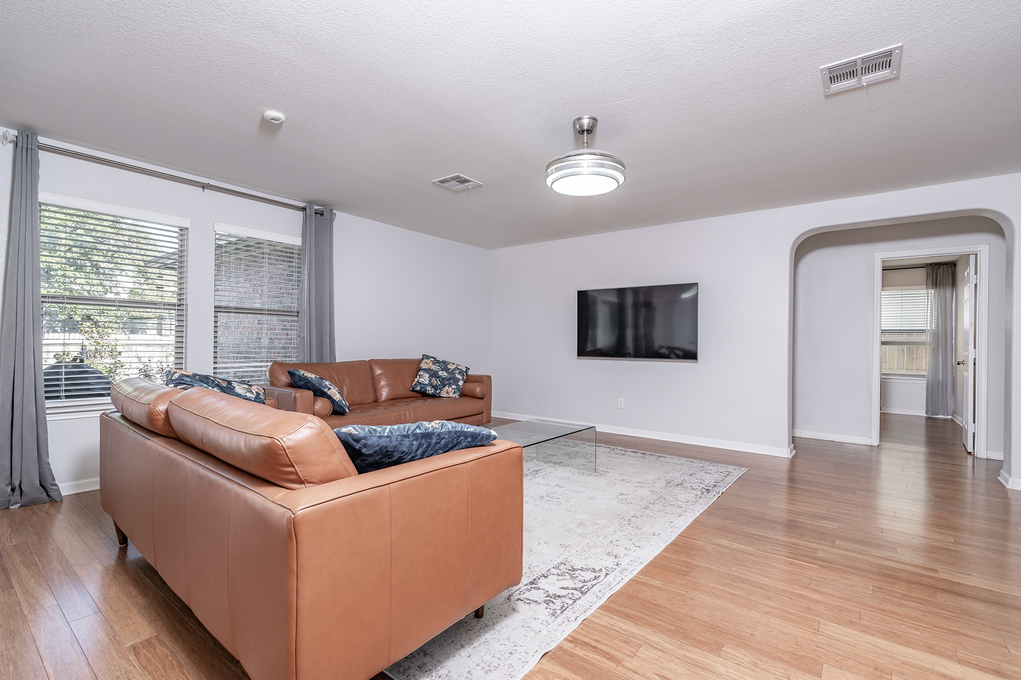 328 Cedar Lake Boulevard Georgetown, TX 78633 - Photo 34 of 34 a living room with furniture and a flat screen tv