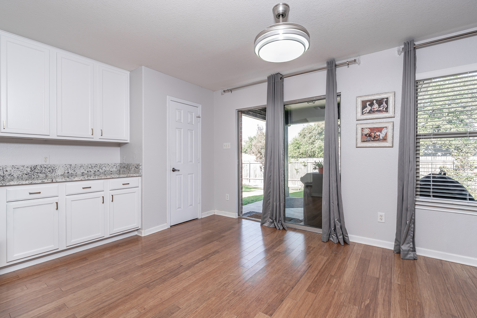 328 Cedar Lake Boulevard Georgetown, TX 78633 - Photo 15 of 34 a kitchen with granite countertop a stove window and cabinets