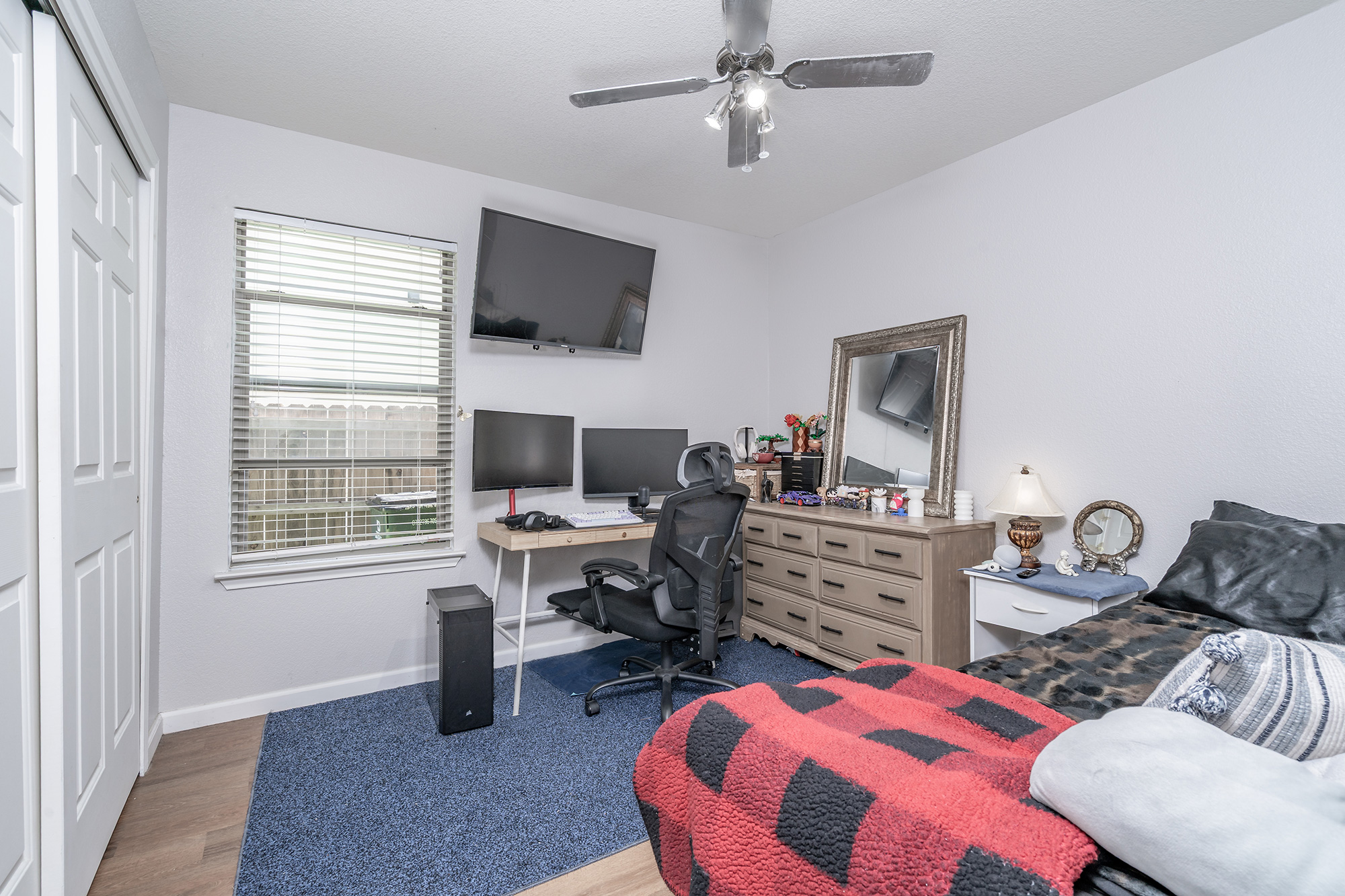 328 Cedar Lake Boulevard Georgetown, TX 78633 - Photo 20 of 34 a bedroom with a bed and a flat screen tv