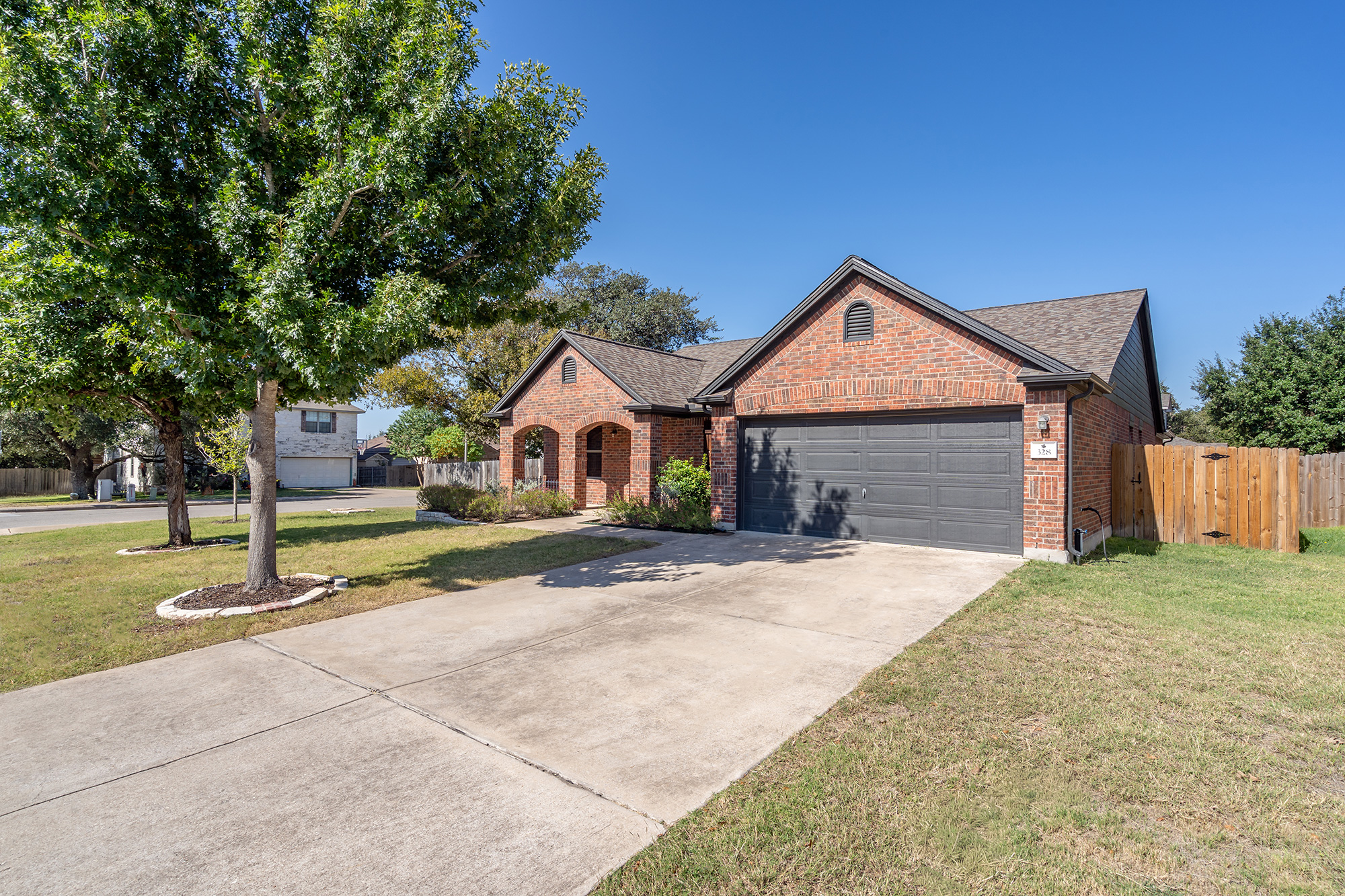 328 Cedar Lake Boulevard Georgetown, TX 78633 - Photo 3 of 34 a front view of a house with a yard and garage