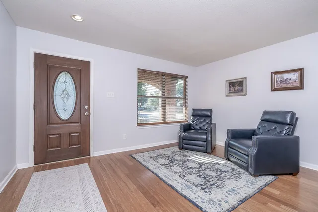 a living room with furniture and a rug