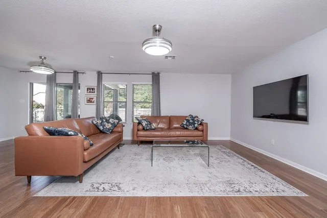 a view of a dining room with furniture window and wooden floor