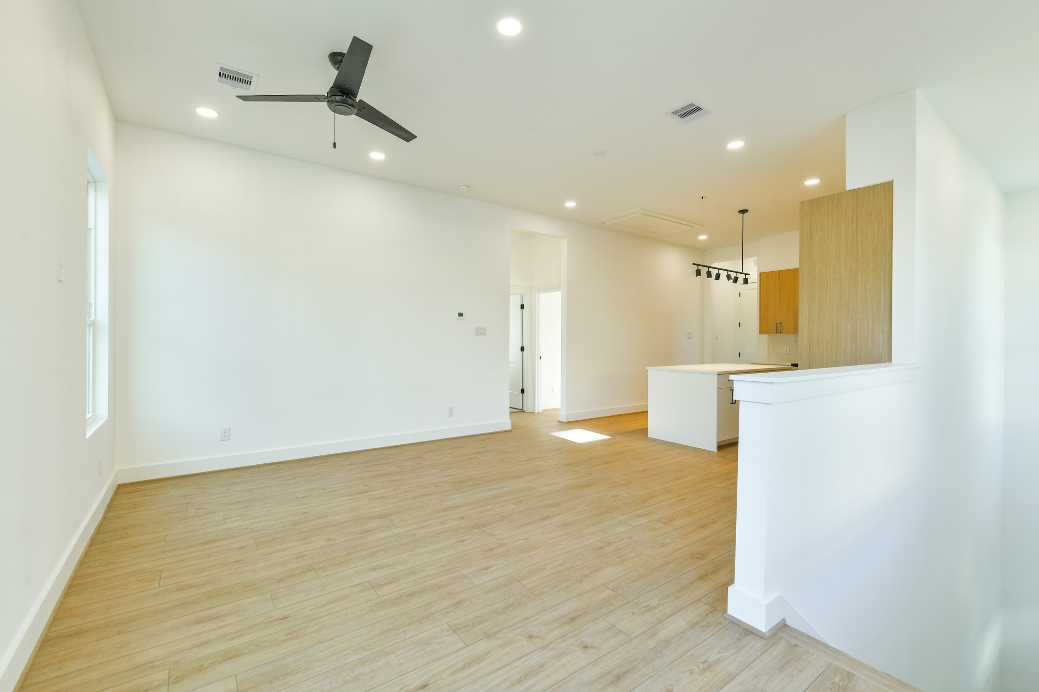 164 Wallace Street Houston, TX 77022 - Photo 26 of 29 a view of empty room with wooden floor