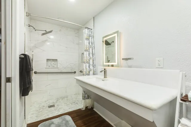 a bathroom with a sink and a mirror