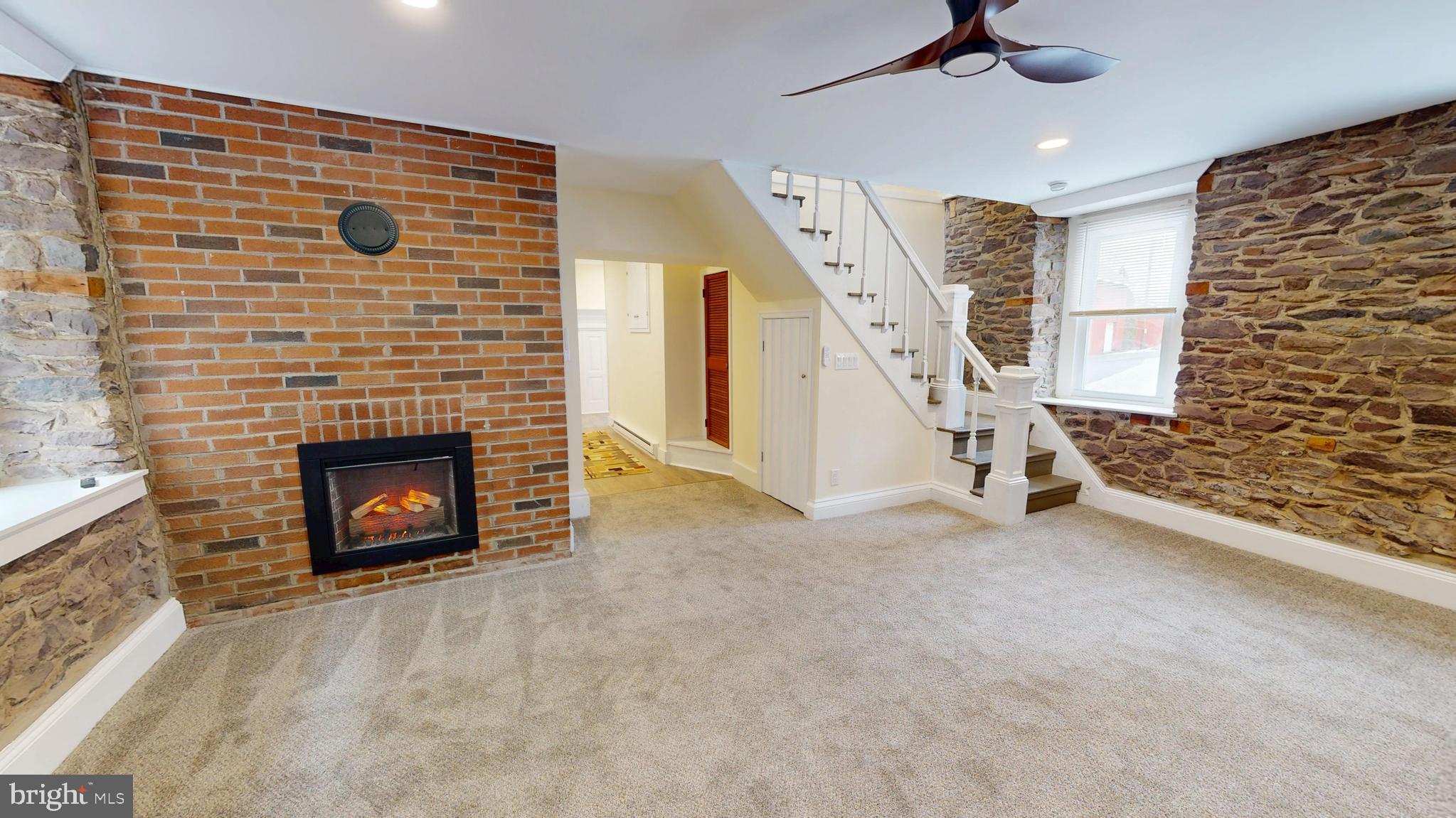 824 Kintner Road Kintnersville, PA 18930 - Photo 15 of 33 a view of an empty room with a fireplace