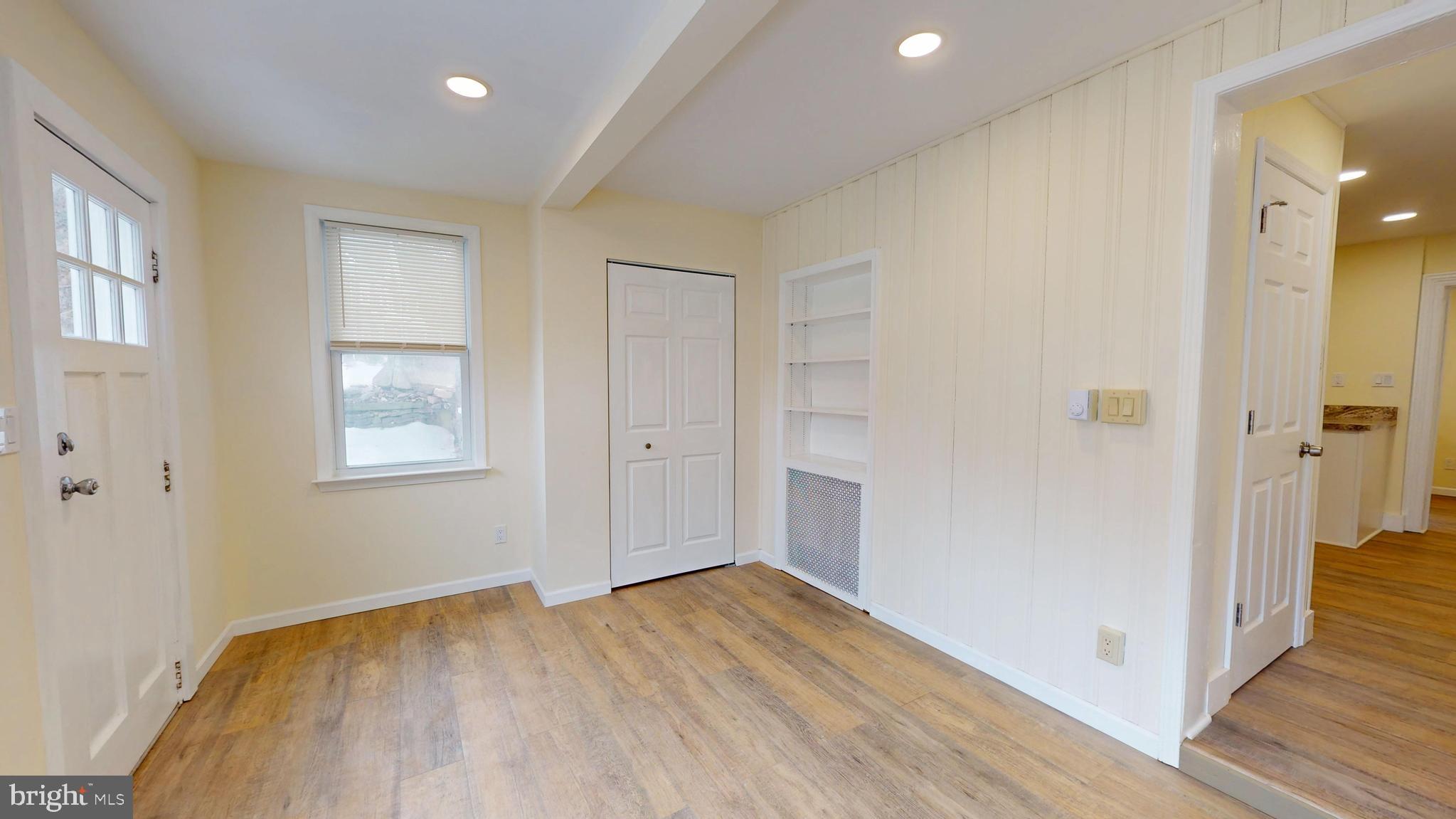824 Kintner Road Kintnersville, PA 18930 - Photo 3 of 33 a view of empty room with wooden floor and fan