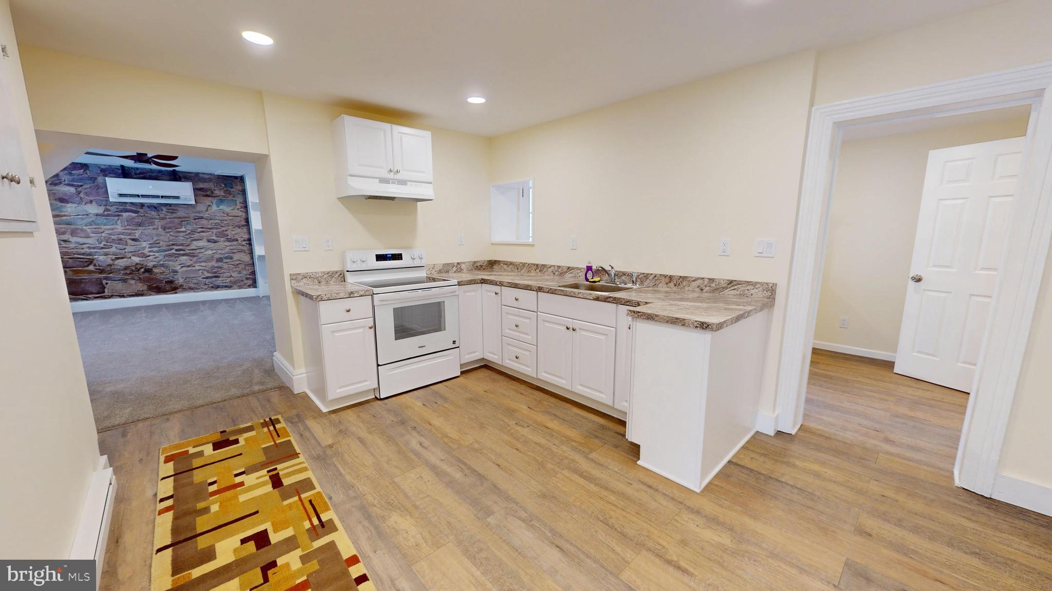 824 Kintner Road Kintnersville, PA 18930 - Photo 5 of 33 a kitchen with stainless steel appliances granite countertop a stove and a sink