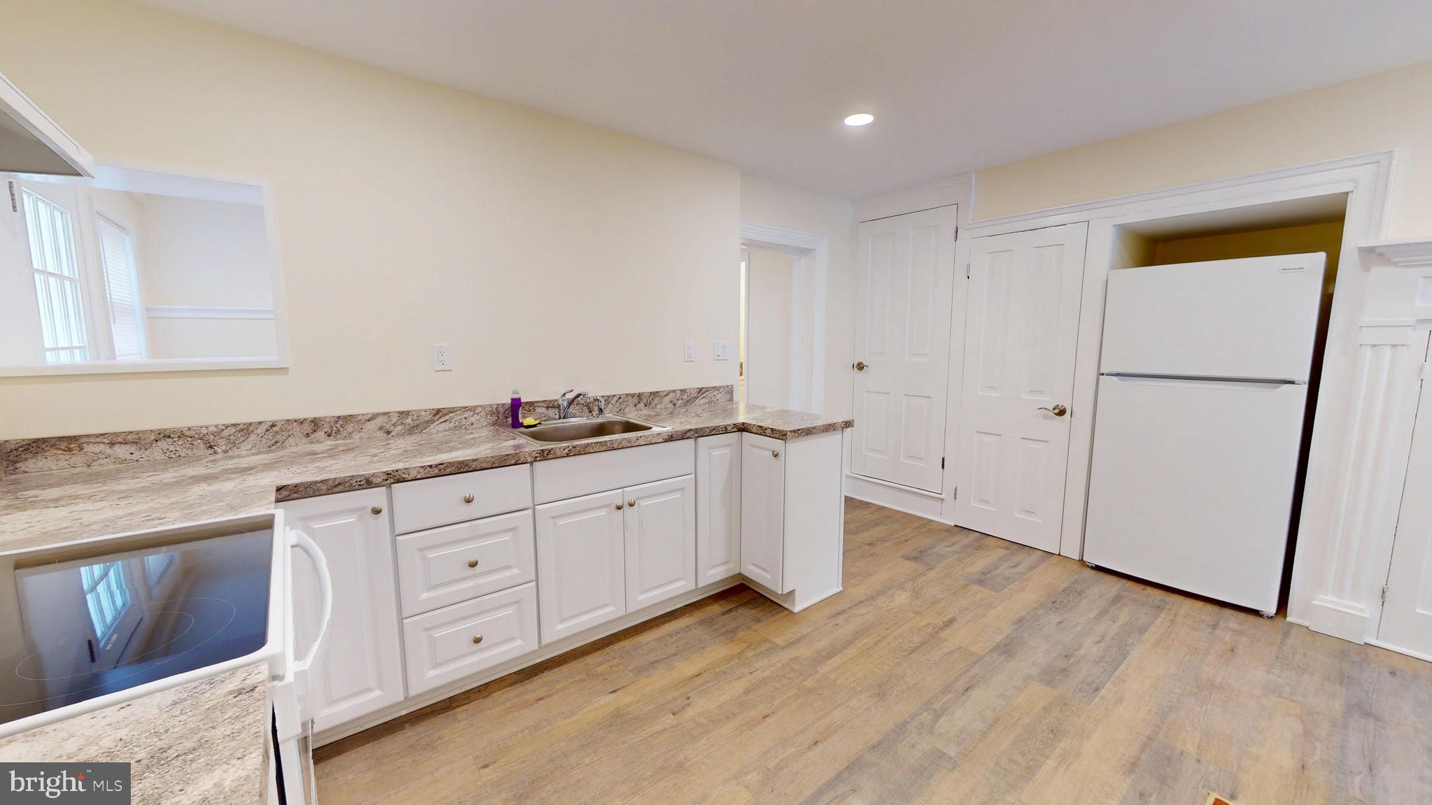 824 Kintner Road Kintnersville, PA 18930 - Photo 7 of 33 a spacious bathroom with a granite countertop sink and a mirror