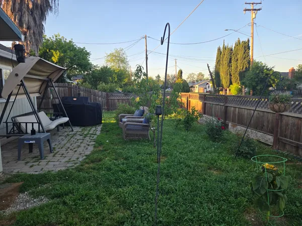 a view of a chairs in a backyard