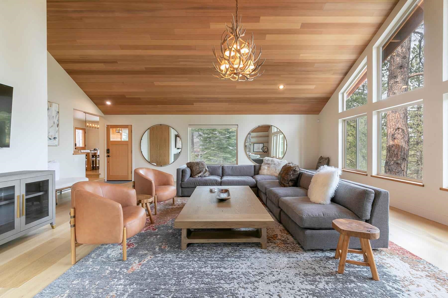 237 Basque Drive Truckee, CA 96161 - Photo 10 of 21 a living room with furniture chandelier and a large window