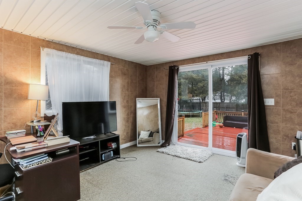 829 River Road Agawam, MA 01001 - Photo 12 of 29 a living room with furniture and a flat screen tv