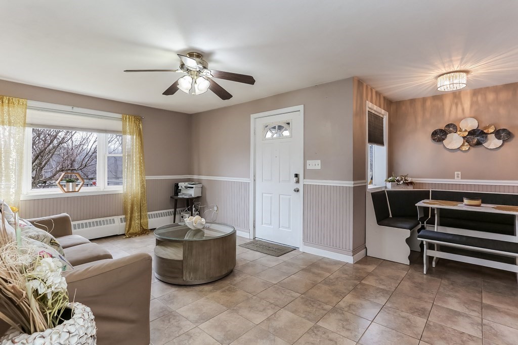 829 River Road Agawam, MA 01001 - Photo 13 of 29 a living room with furniture and a chandelier