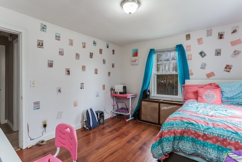 829 River Road Agawam, MA 01001 - Photo 18 of 29 a bedroom with a bed and wooden floor