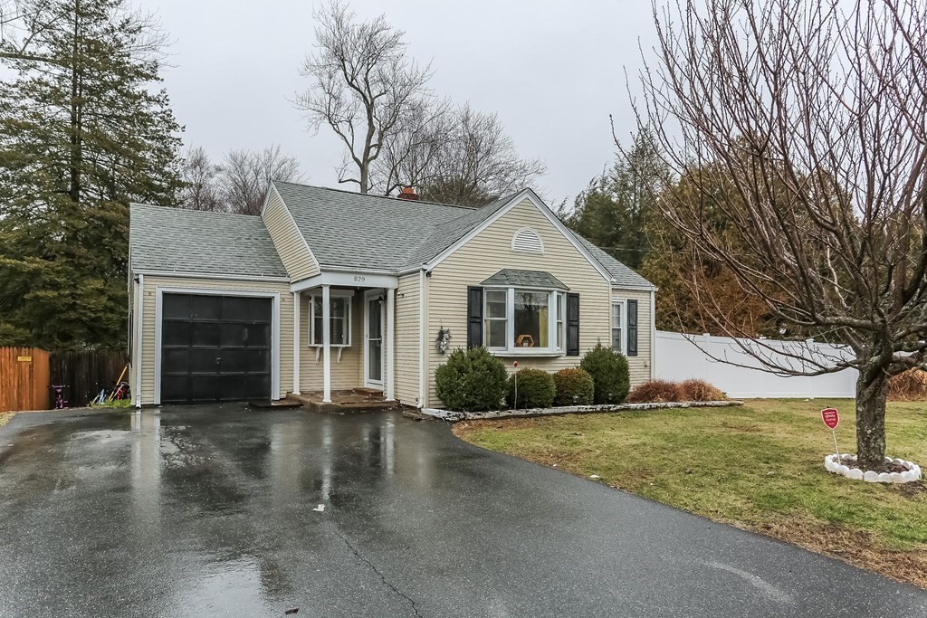 829 River Road Agawam, MA 01001 - Photo 2 of 29 a front view of a house with a yard and garage