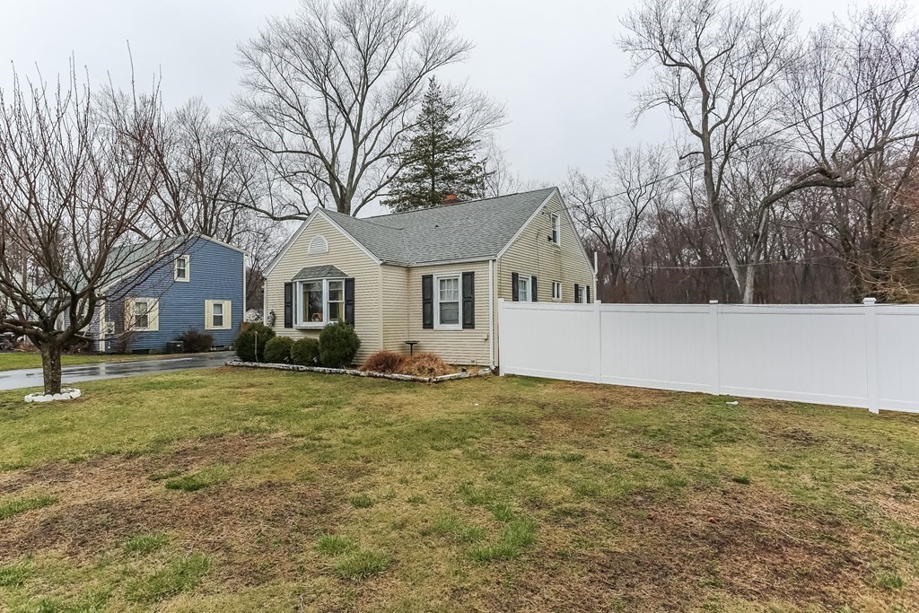 829 River Road Agawam, MA 01001 - Photo 3 of 29 a front view of a house with a yard