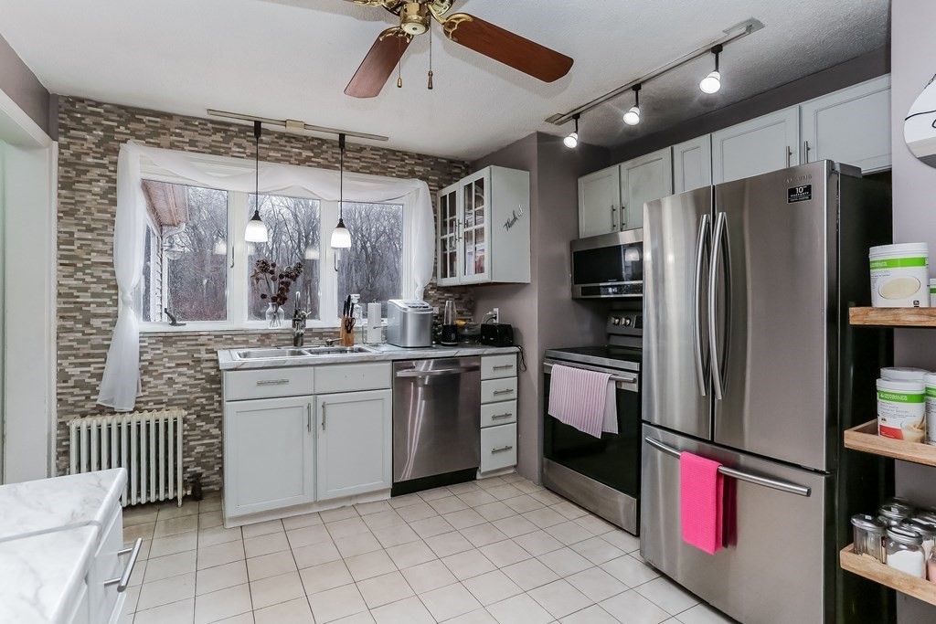 829 River Road Agawam, MA 01001 - Photo 4 of 29 a kitchen with stainless steel appliances granite countertop a refrigerator and a sink