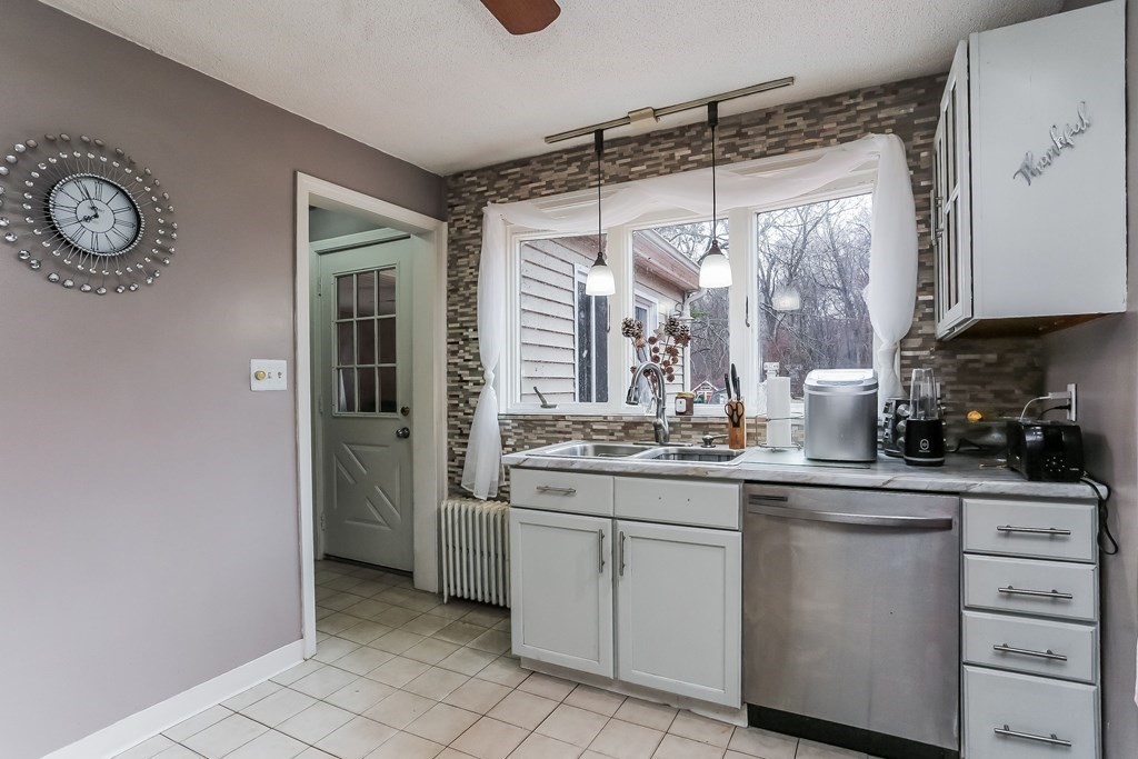829 River Road Agawam, MA 01001 - Photo 6 of 29 a kitchen with a sink and cabinets