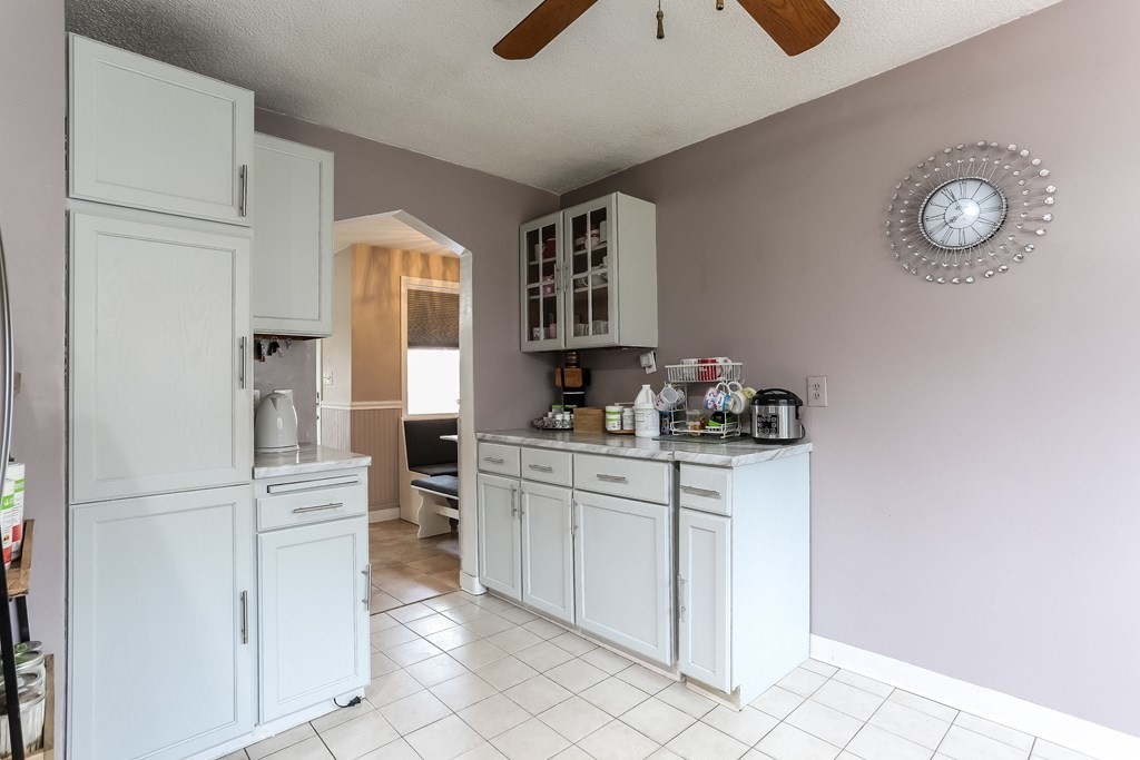 829 River Road Agawam, MA 01001 - Photo 7 of 29 a kitchen with cabinets and chairs