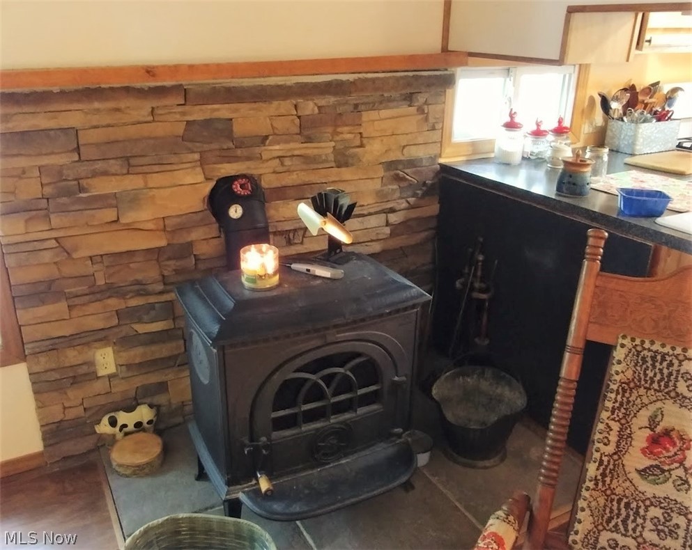 3948 Ayers Road Dorset, OH 44032 - Photo 7 of 20 Great wood burning stove in LR. Capable of heating whole home.