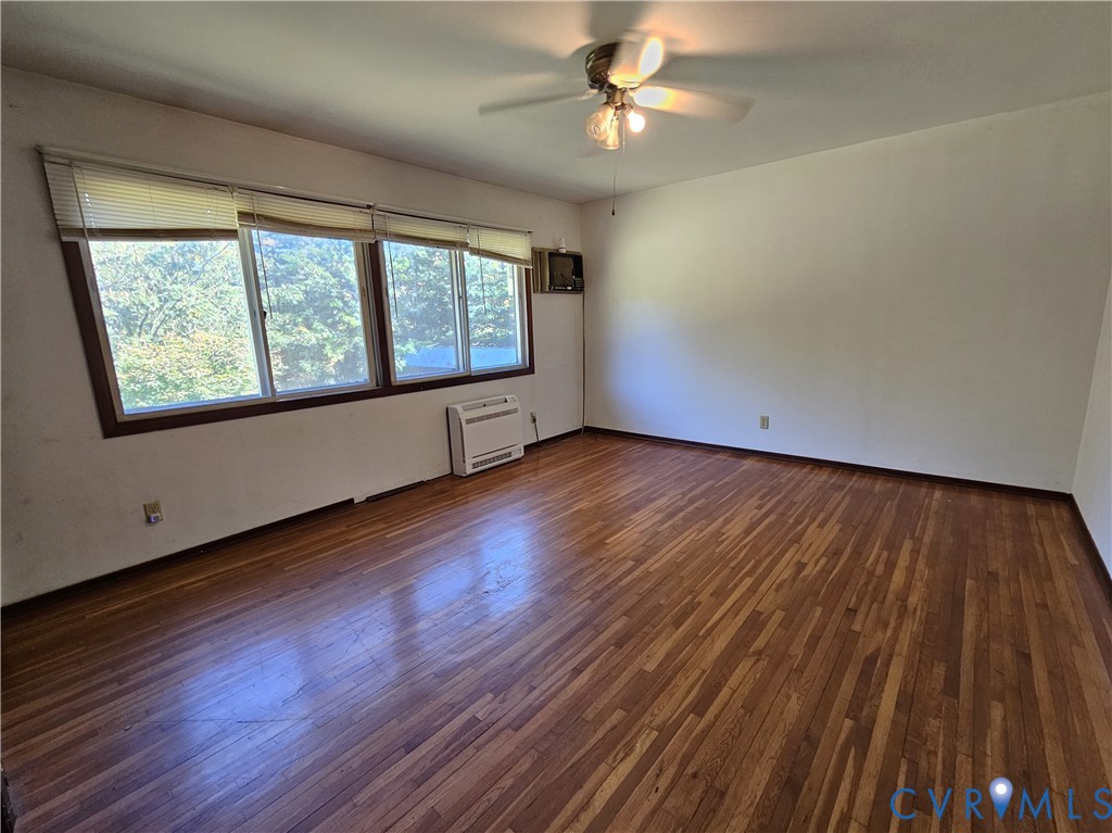 37 Bear Branch Road Farmville, VA 23901 - Photo 12 of 48 a view of an empty room with wooden floor and a window