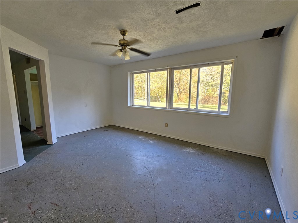 37 Bear Branch Road Farmville, VA 23901 - Photo 18 of 48 an empty room with windows and fan