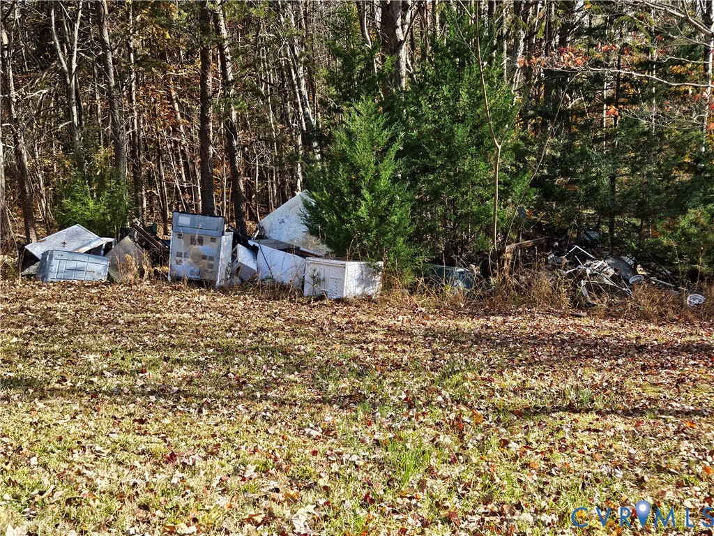 37 Bear Branch Road Farmville, VA 23901 - Photo 42 of 48 a view of a chairs and table in a backyard