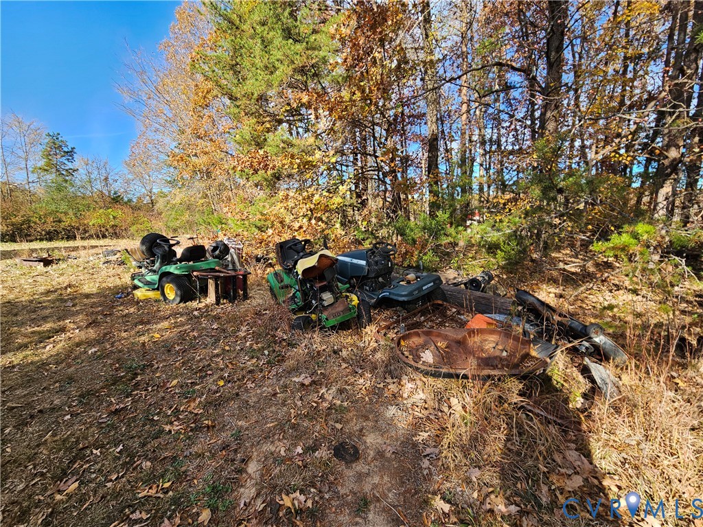 37 Bear Branch Road Farmville, VA 23901 - Photo 45 of 48 a backyard of a house with table and chairs