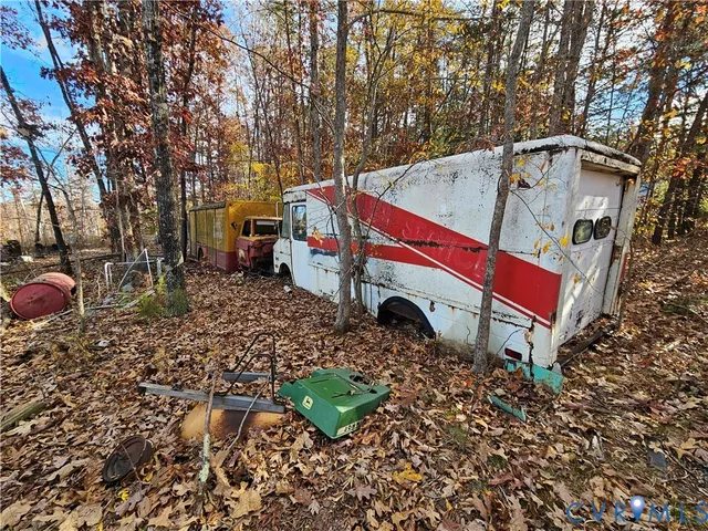 an empty room with wooden floor