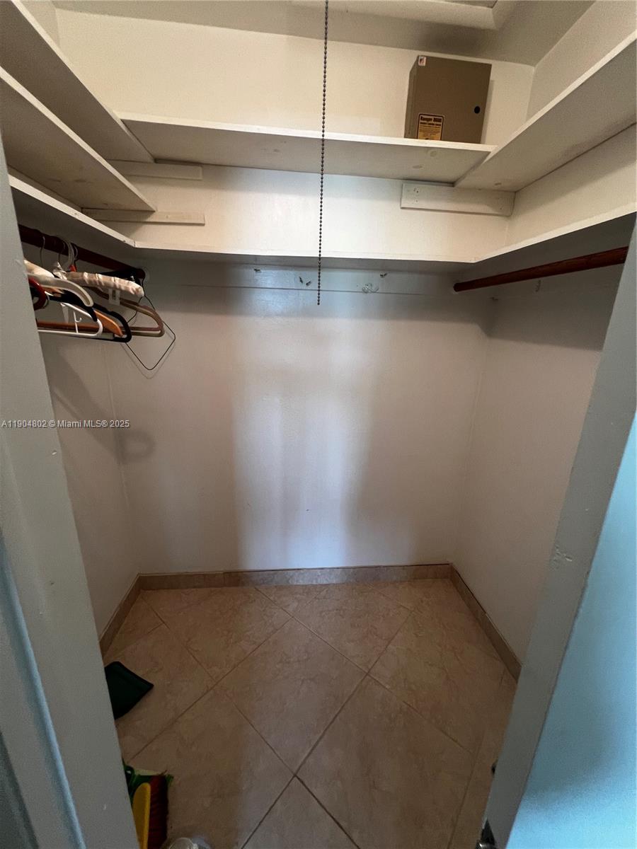 1501 Arthur Street, Unit 9 Hollywood, FL 33020 - Photo 14 of 20 a view of a room with racks on the wall