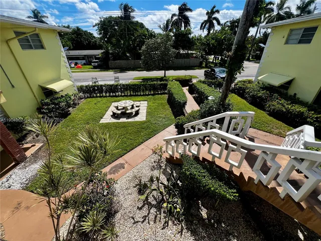 a view of a backyard with plants