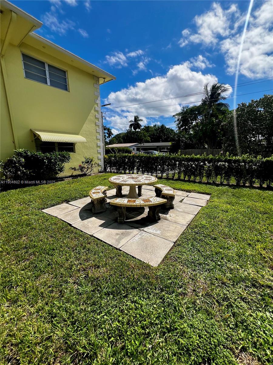 1501 Arthur Street, Unit 9 Hollywood, FL 33020 - Photo 19 of 20 a view of a house with backyard patio and swimming pool