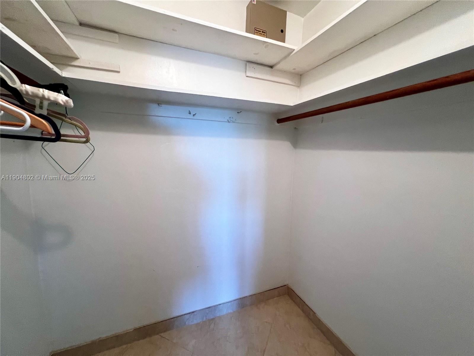 1501 Arthur Street, Unit 9 Hollywood, FL 33020 - Photo 9 of 20 a view of a room with racks on the wall