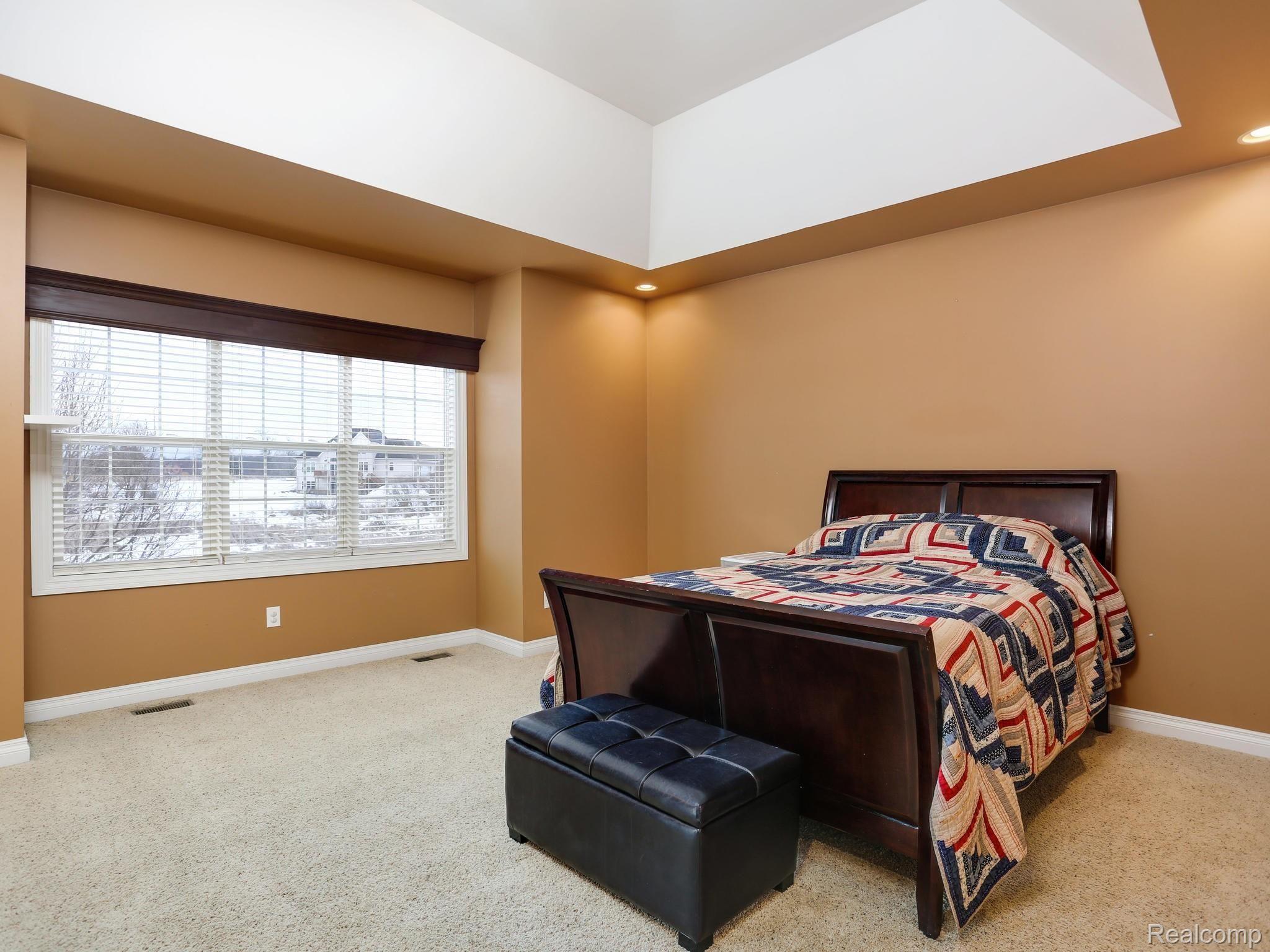 1067 Marsh Ridge Brighton, MI 48114 - Photo 17 of 39 The master suite is pure luxury. The generous space easily accommodates a California King with room for a chaise lounge chair in front of the panoramic set of windows.