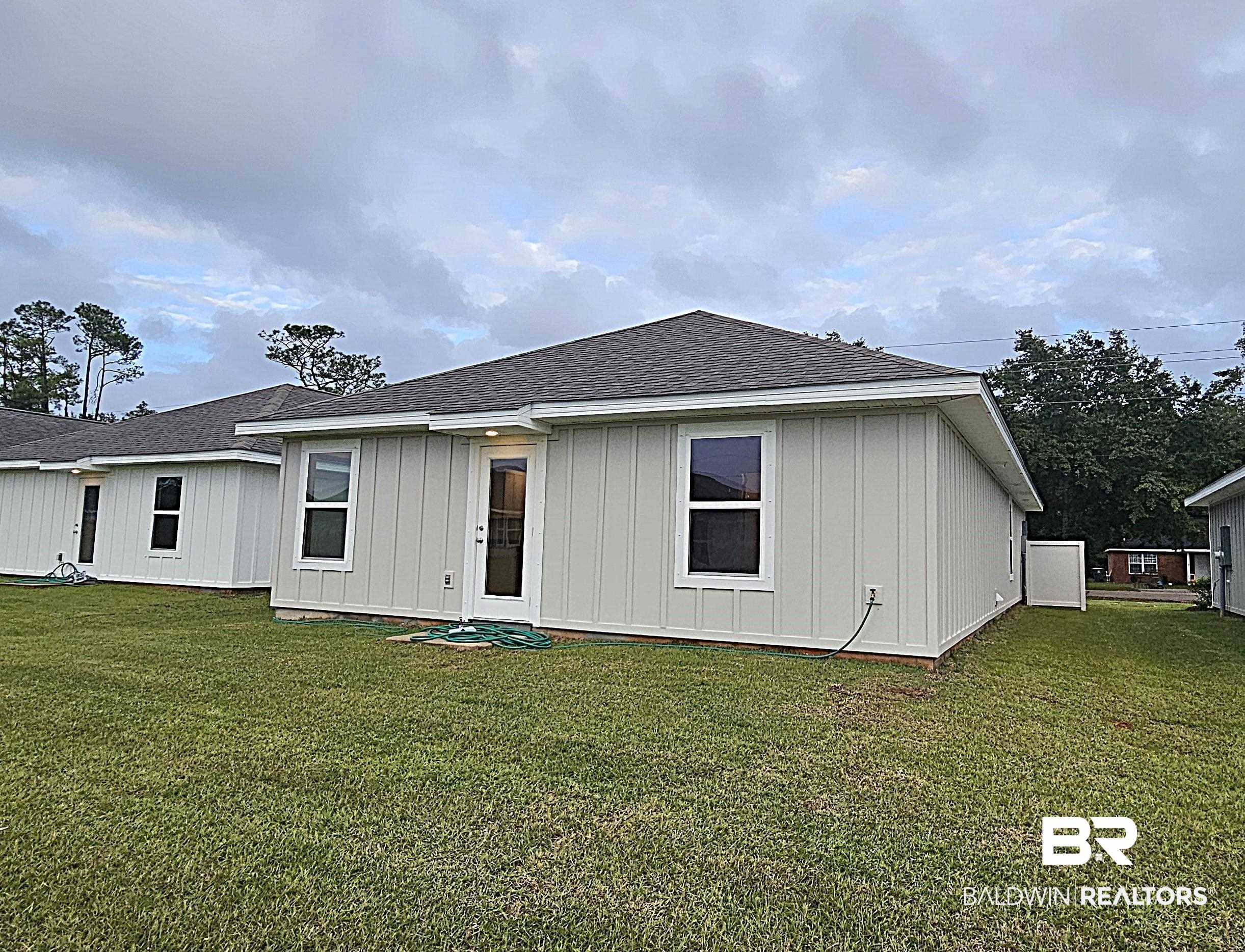1060 South Bay Street Foley, AL 36535 - Photo 10 of 35 Back of house with a yard