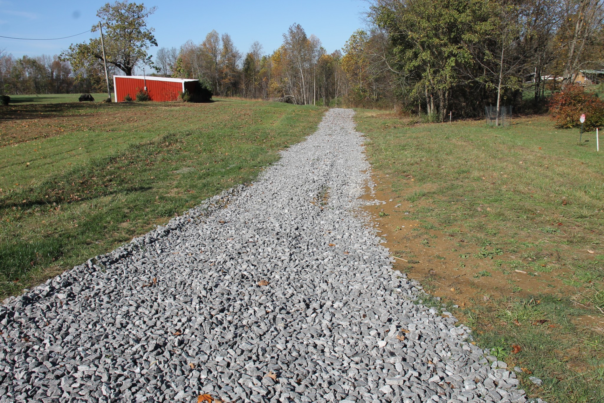 221 Whitson Road Bethpage, TN 37022 - Photo 2 of 8 a view of a field with large trees