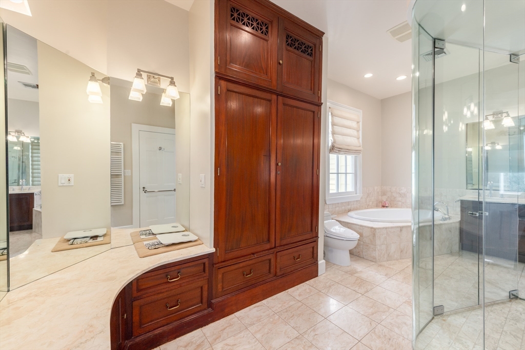 355 Buckminster Road Brookline, MA 02445 - Photo 14 of 32 a spacious bathroom with a bathtub shower sink and toilet