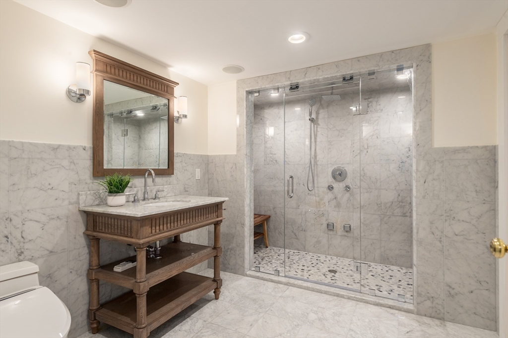 355 Buckminster Road Brookline, MA 02445 - Photo 18 of 32 a bathroom with a sink a toilet and shower