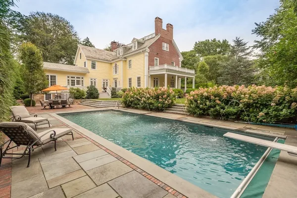 a front view of a house with swimming pool