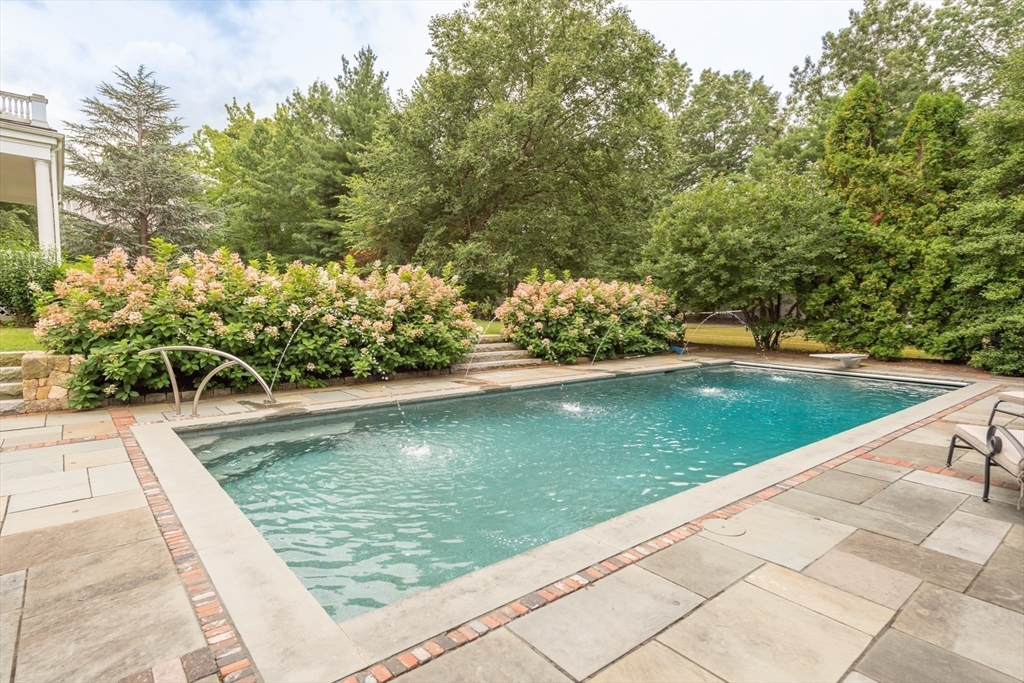 355 Buckminster Road Brookline, MA 02445 - Photo 26 of 32 a view of a swimming pool with a patio