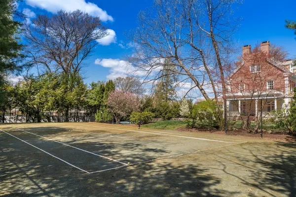 a view of a playground with basketball court