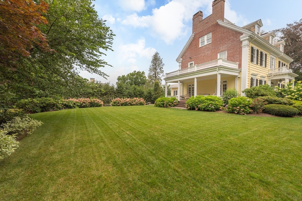 355 Buckminster Road Brookline, MA 02445 - Photo 31 of 32 a view of a house with a garden