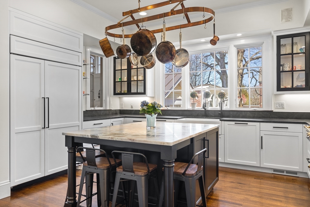 355 Buckminster Road Brookline, MA 02445 - Photo 5 of 32 a kitchen with a table and chairs in it