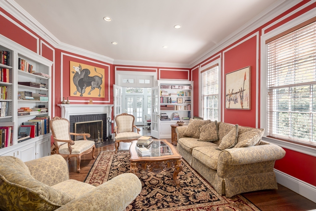355 Buckminster Road Brookline, MA 02445 - Photo 8 of 32 a living room with fireplace furniture and large windows