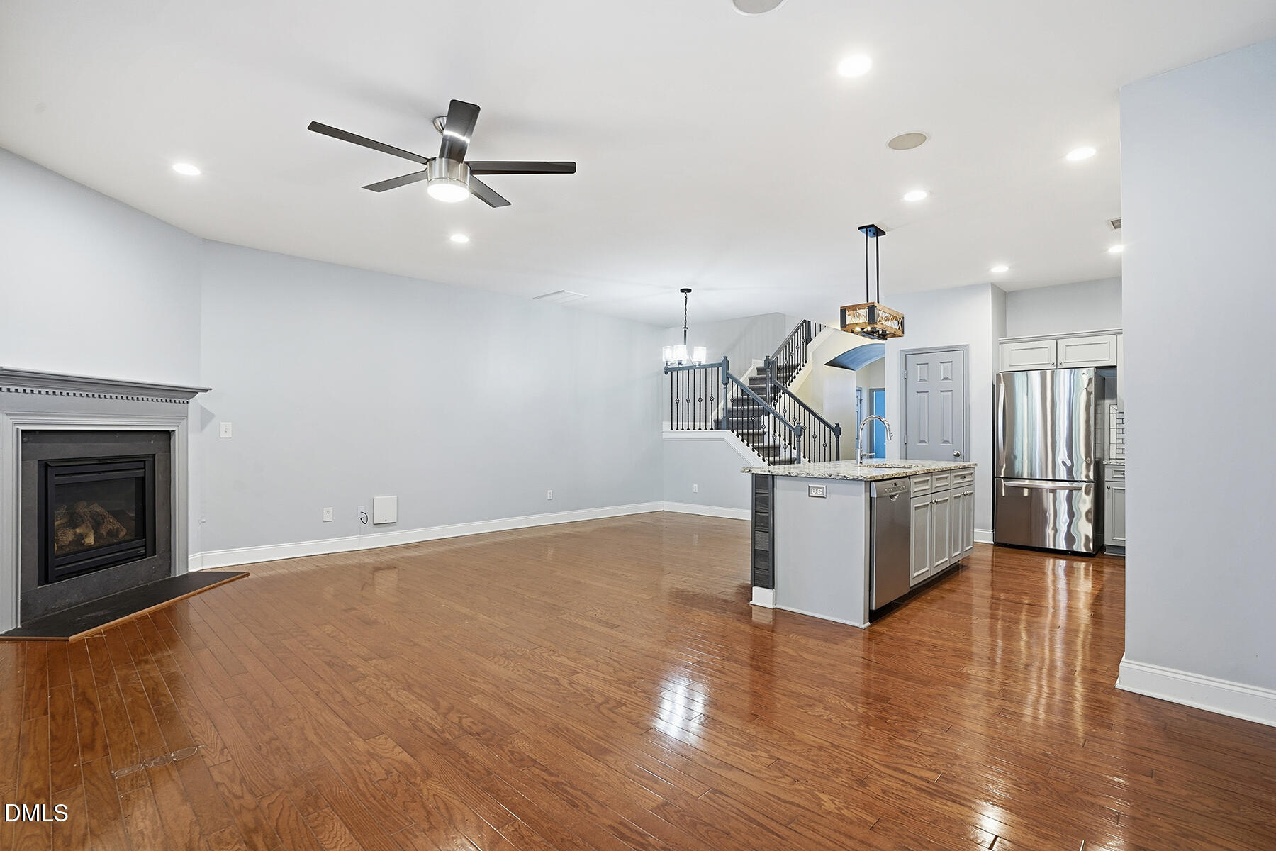 520 Camden Yards Way Cary, NC 27519 - Photo 11 of 30 a view of a room with wooden floor and a ceiling fan