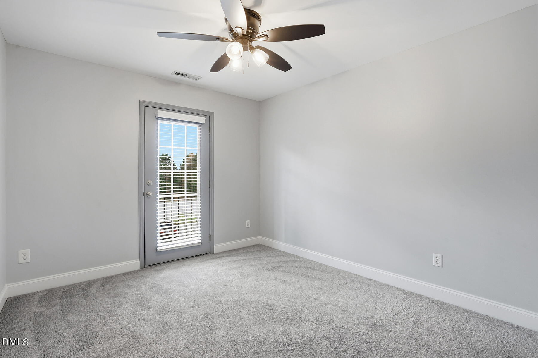 520 Camden Yards Way Cary, NC 27519 - Photo 21 of 30 an empty room with windows and fan