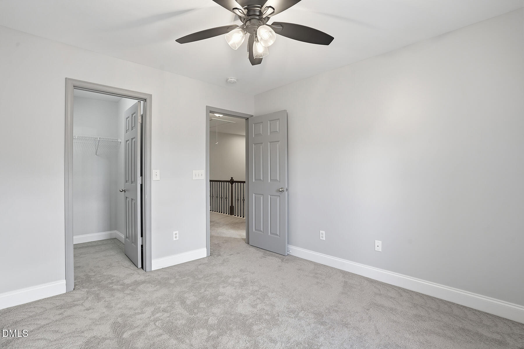 520 Camden Yards Way Cary, NC 27519 - Photo 22 of 30 an empty room with closet and a chandelier fan