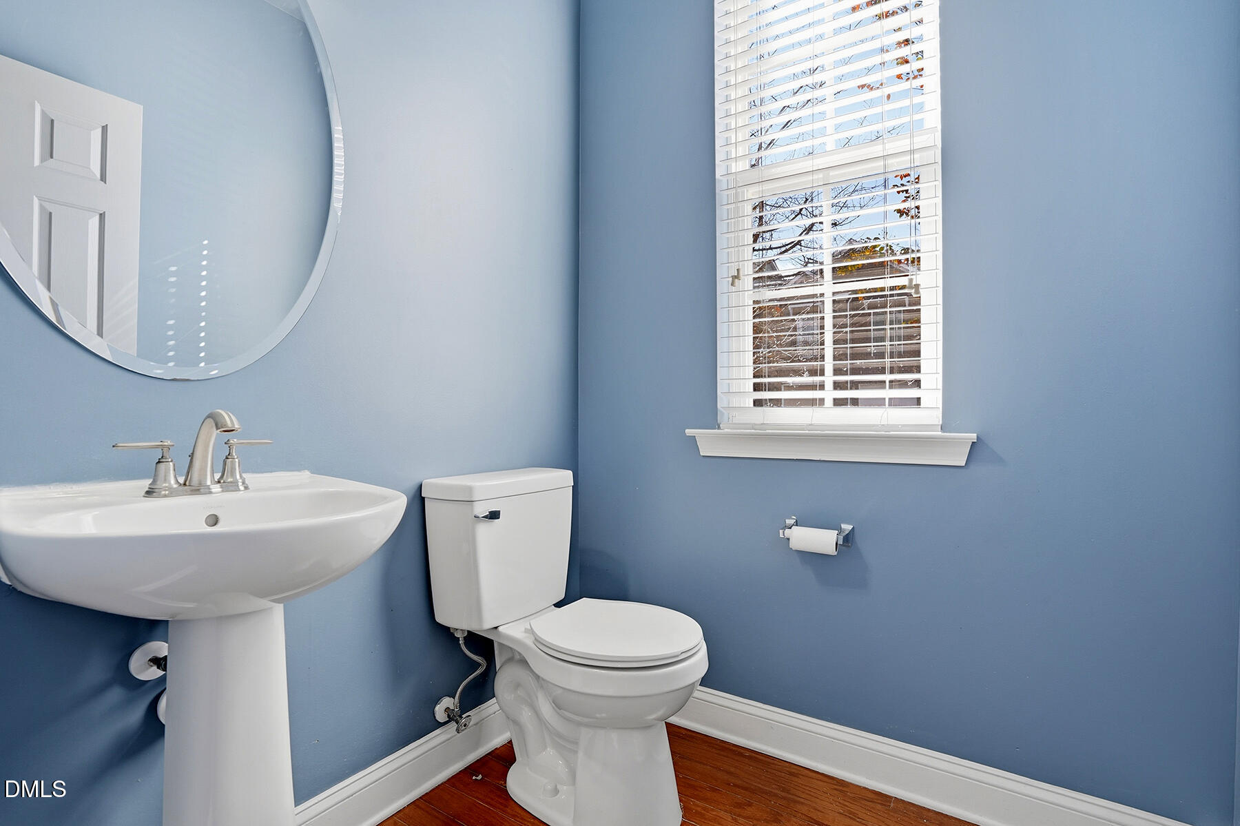 520 Camden Yards Way Cary, NC 27519 - Photo 7 of 30 a bathroom with a sink a mirror and a toilet