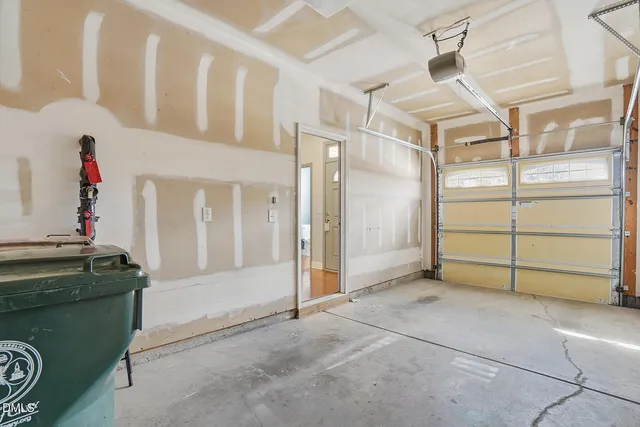 a view of a livingroom with wooden floor and cabinet