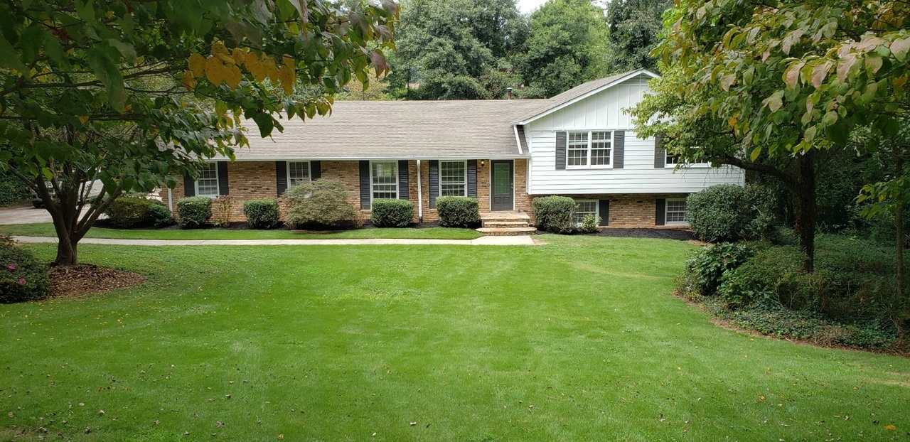 528 Chestnut Hill Road Southwest, Unit 8 Marietta, GA 30064 - Photo 1 of 1 a front view of a house with a yard